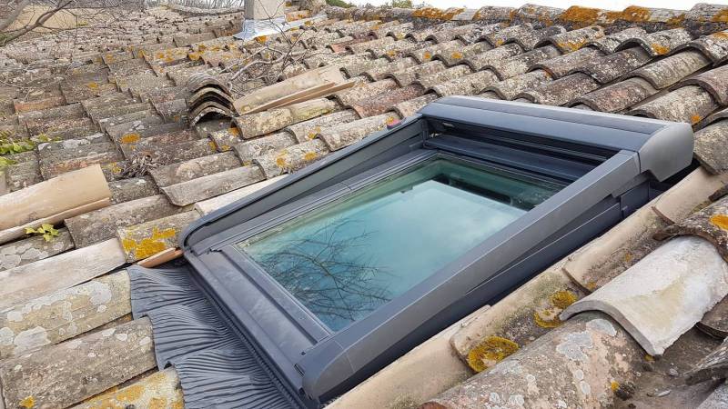 Vélux sur toiture ancienne